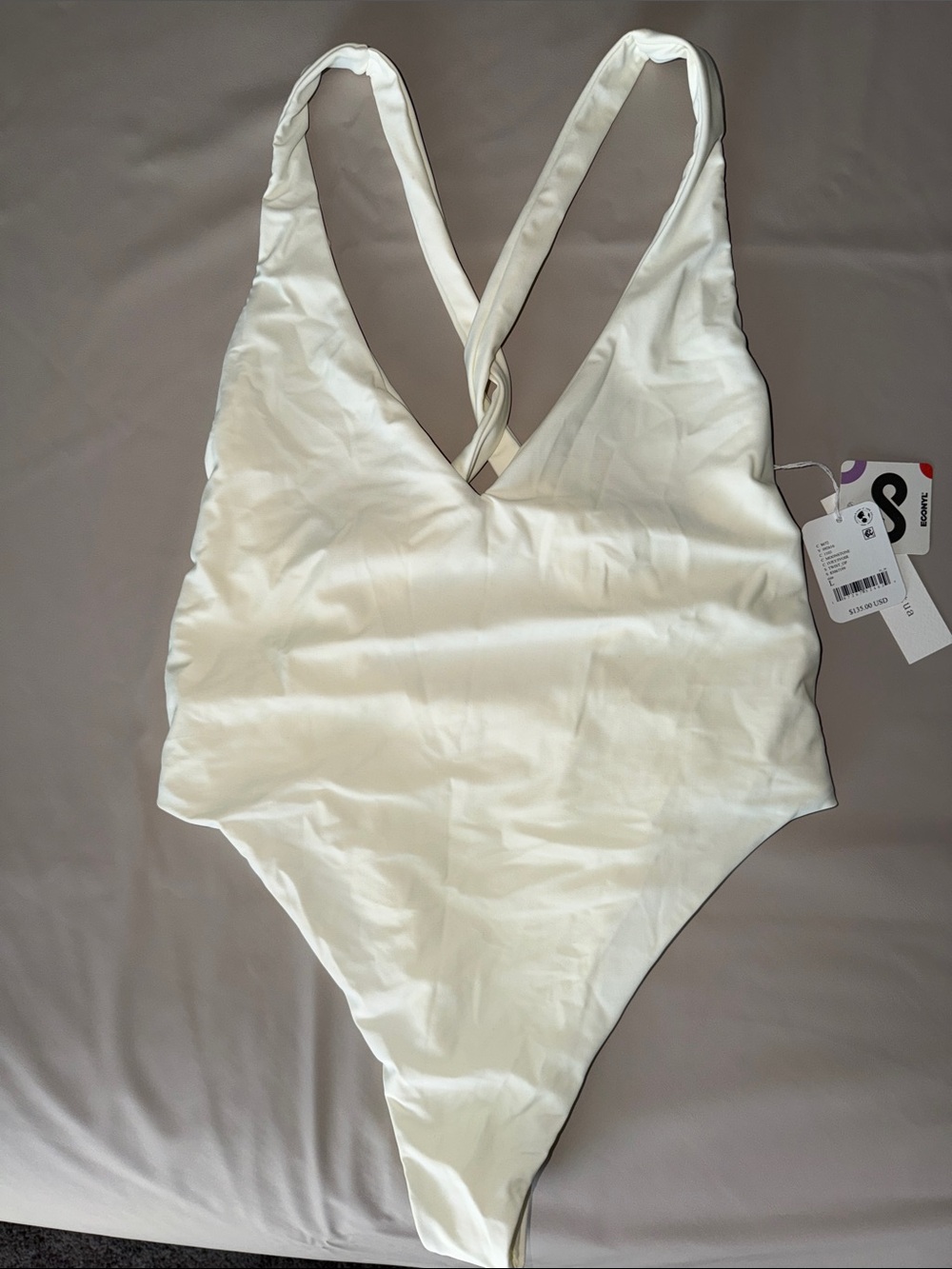 NWT FreePeople Off White One-Piece Swimsuit with Twist-Back Straps